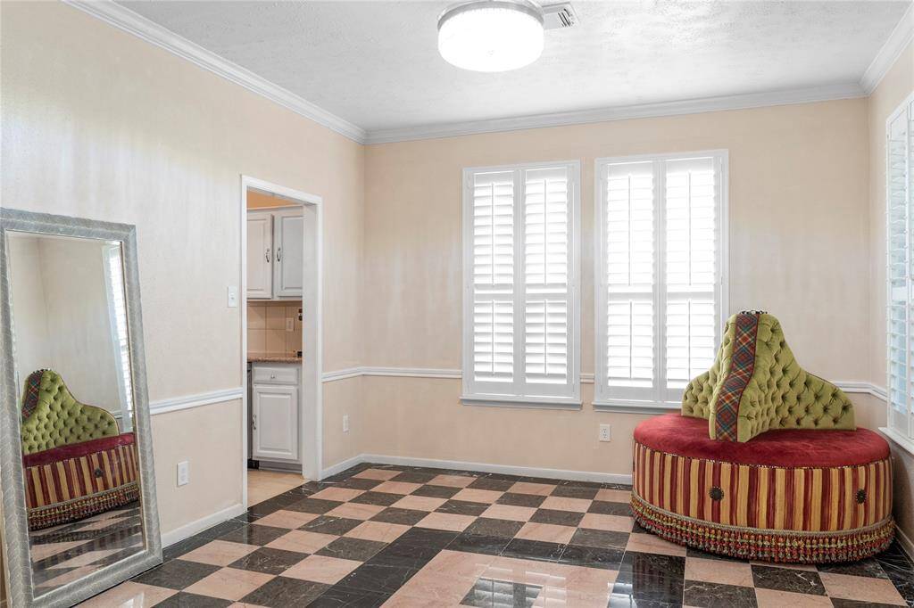 A versatile room downstairs can serve as either an office or a formal dining room.