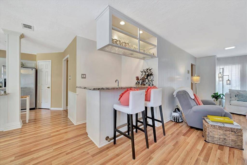 The double back doors have recently been replaced and offer beautiful views of the pool and backyard space.