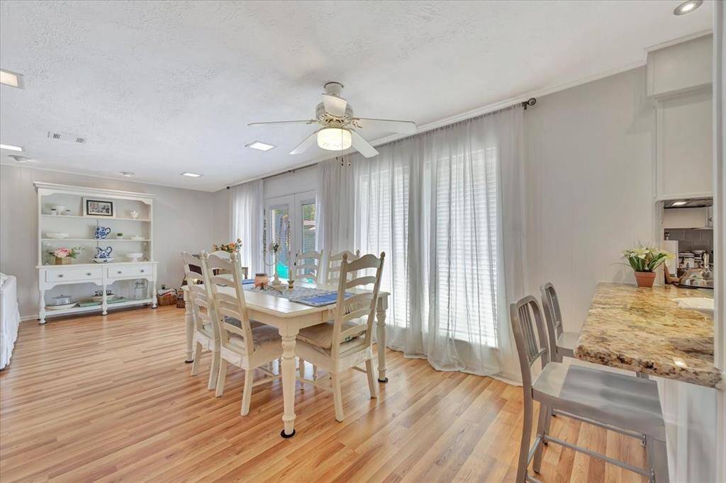 Another view shows there is additional room just off the family room.  The seller is using this space for a beautiful hutch to showcase their favorite pieces.