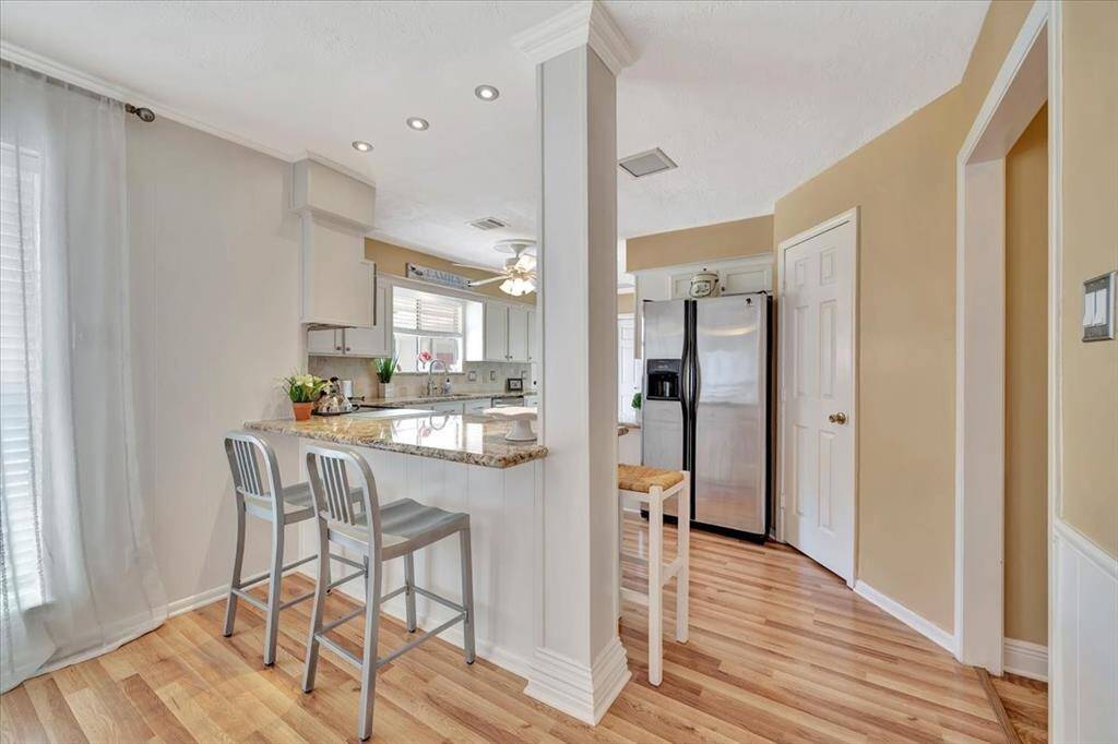 Another view of the family room also showing the wet bar.  So much storage for your favorite things!