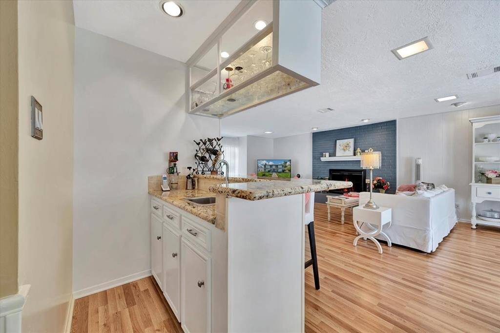 The kitchen offers stainless appliances, lots of counter space, a backdoor just out to the pool area and garage.