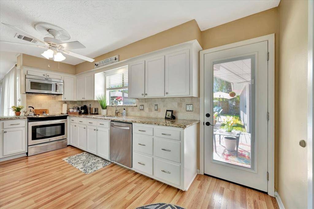 Another view of the kitchen with a formal dining room just through the door.