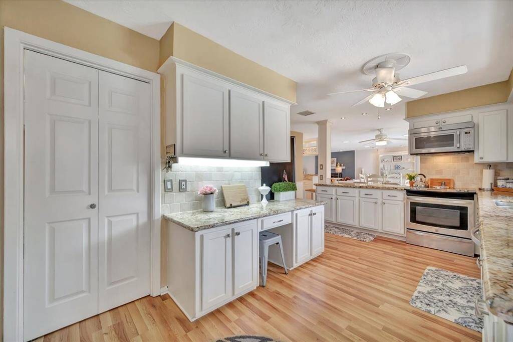 This kitchen has ample drawer and counter space complimented by beautiful granite counters.