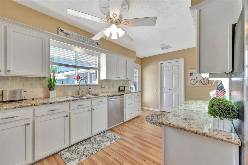 Notice this gorgeous  flooring flows throughout the downstairs.