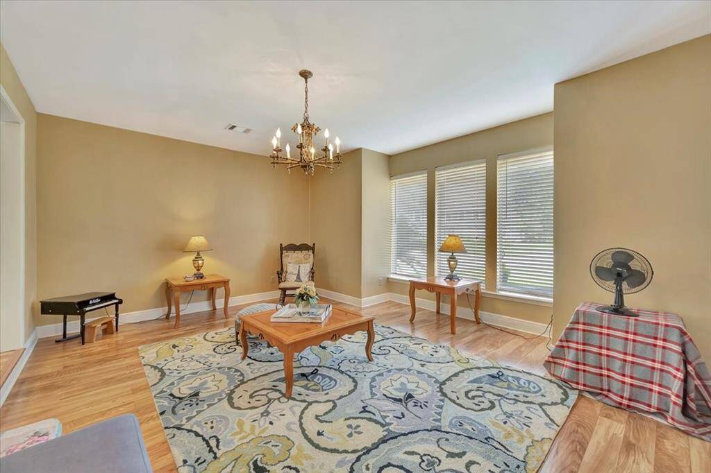 Here is another view of the den offering lots of natural light and built in bookcases.