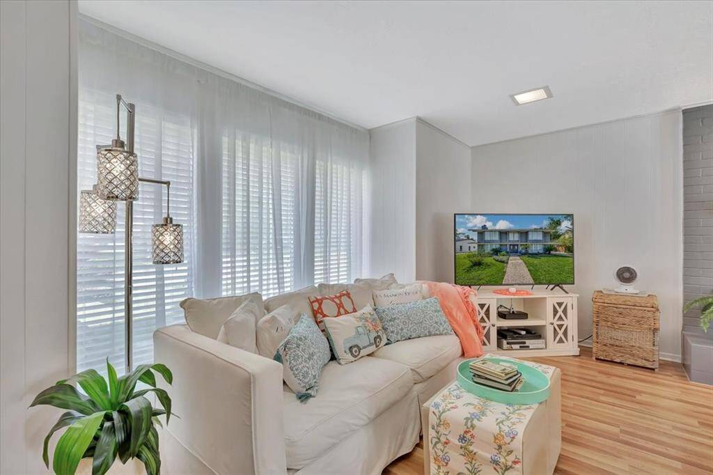 Beautiful wood like flooring sweeps throughout the downstairs living areas and you'll never get tired of the pool views!
