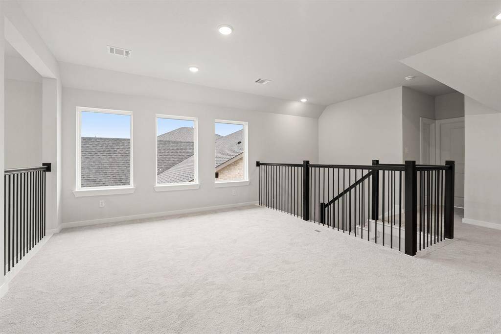 The Donley plan includes a spacious game room, ideal for entertaining or as a flexible space for family activities.