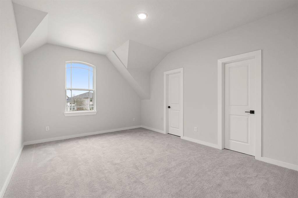 Oversized secondary bedroom, offering plenty of space for comfort and flexibility in use.
