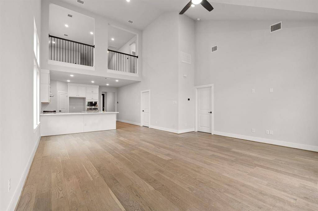 An open upstairs design overlooking the living space below, enhancing the home's airy and connected feel.