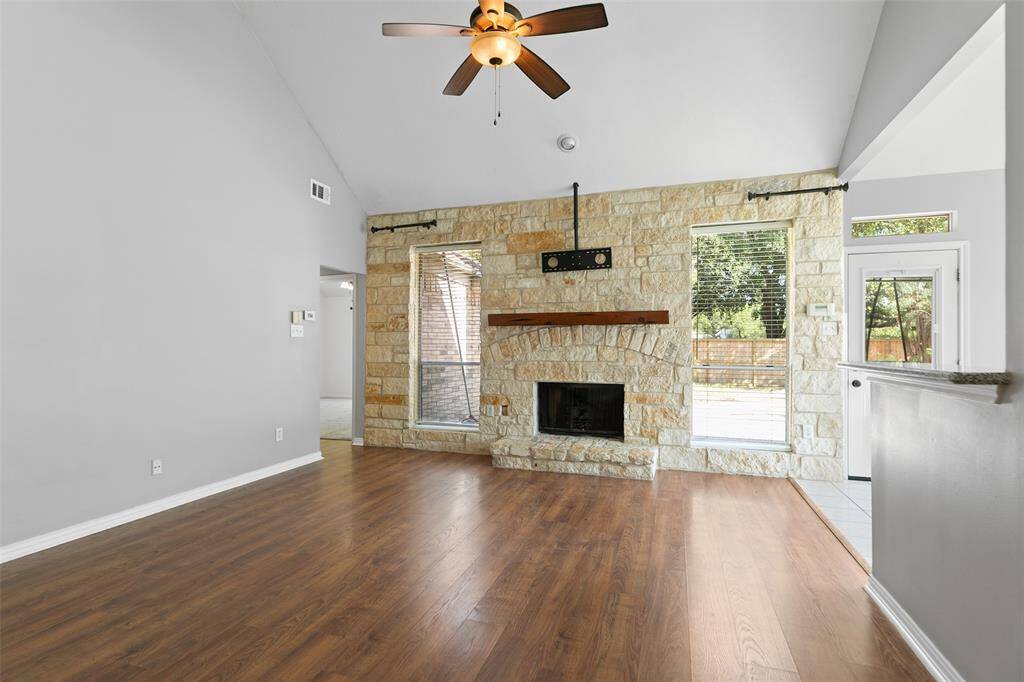 Beautiful limestone fireplace with mantle is the focal point of this living area.