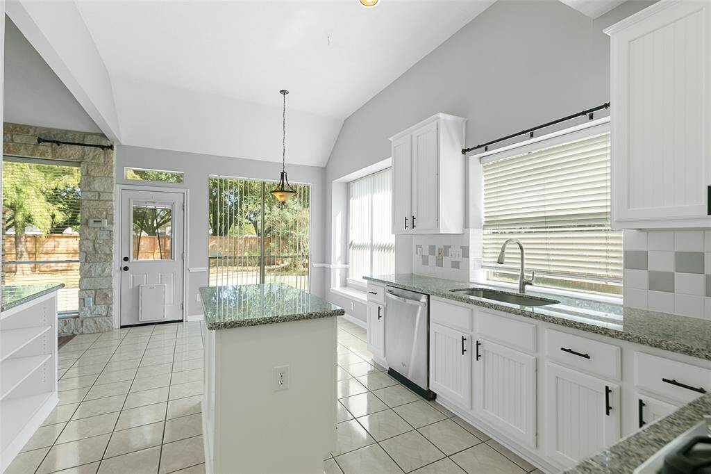 Lots of cabinet and counter space along with a kitchen island. Separate pantry for food storage.