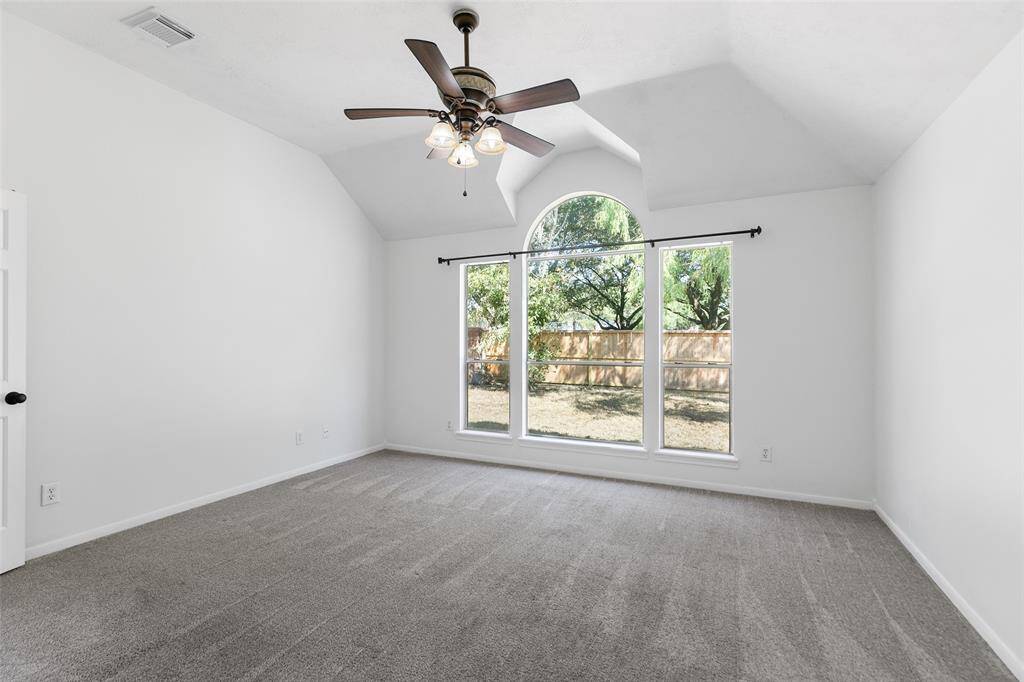 Generously sized main bedroom overlooks your pool and backyard.