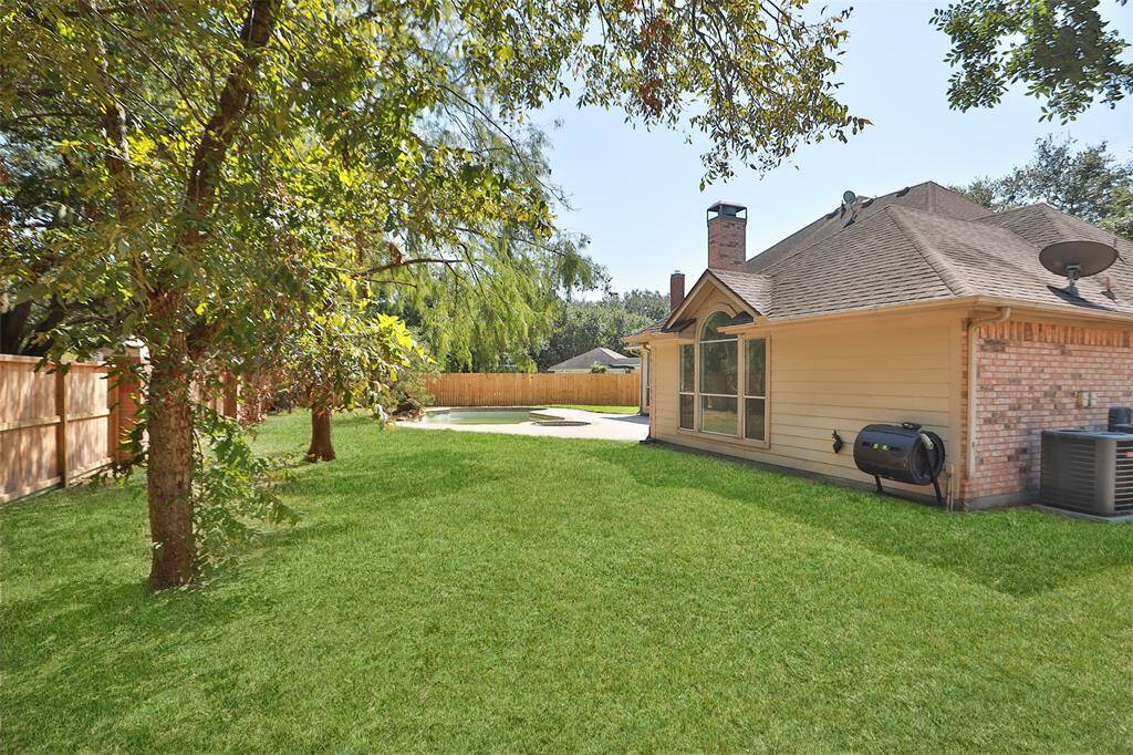 Large grassy area-perfect for trampoline, play equipment.