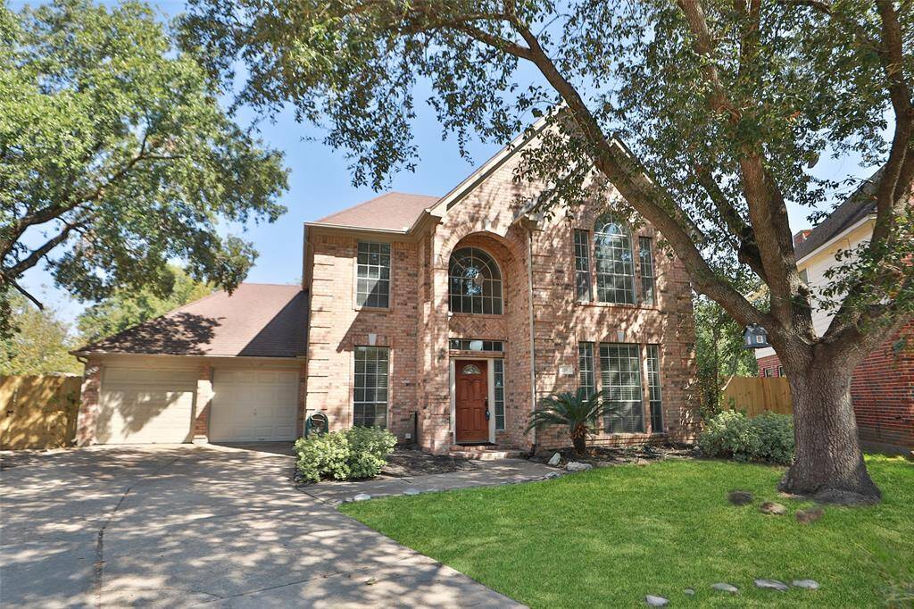 Walk up the sidewalk to your brand new home, Arched window and side lights let in natural light.
