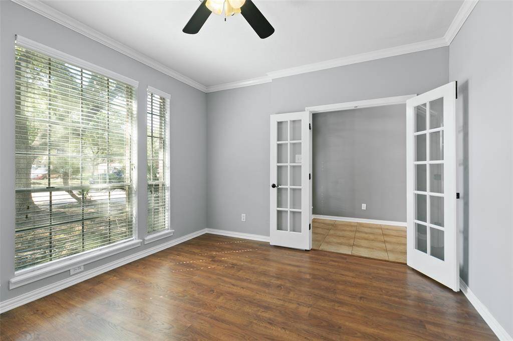 Window pane double doors give the study the privacy and quiet you need to work from home.