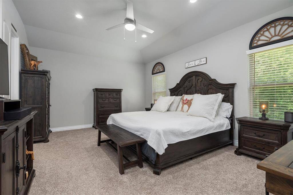 Primary bedroom is located  in the rear of house offers tranquility!