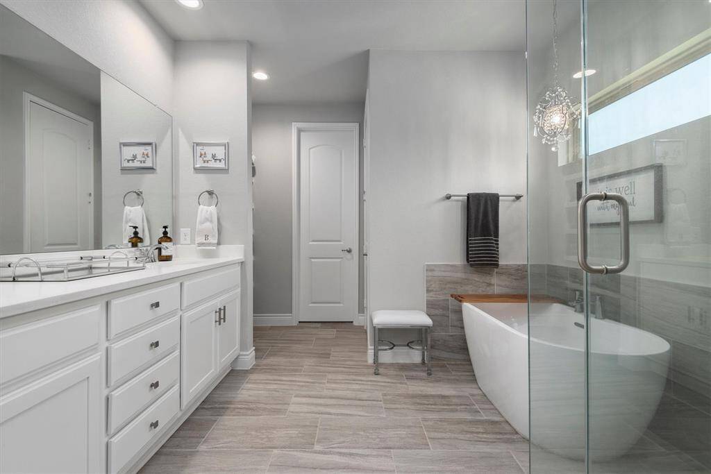 The en-suite bath is exquisite! Can you imagine relaxing in this soaking tub?
