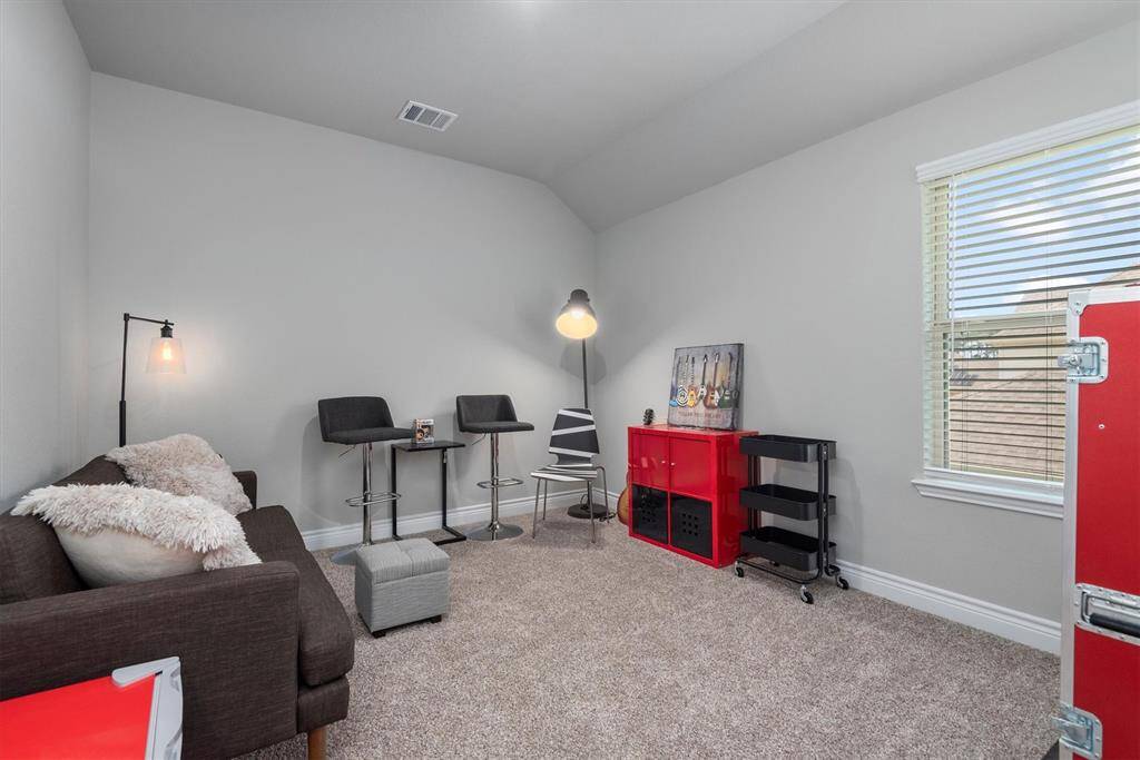 Secondary Bedroom 3 located in front of house with a huge walk in closet.