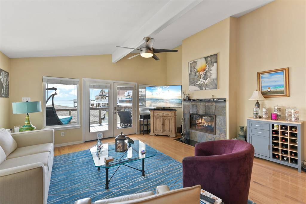 Pictured here the main focal point is the fireplace with guests chairs around to see the views from the windows.