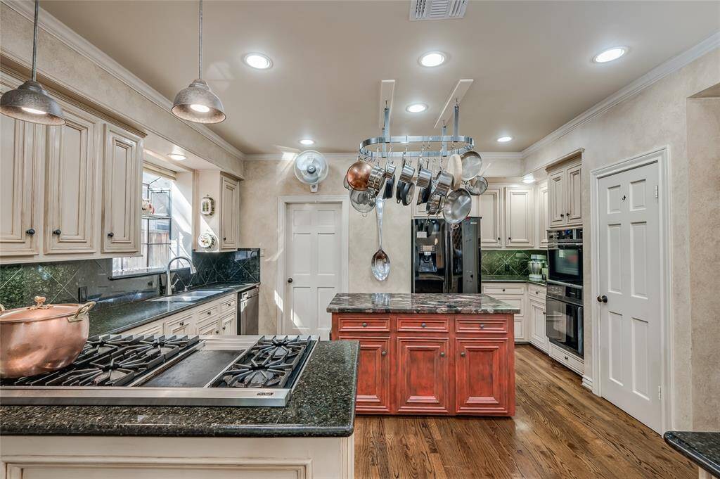 The utility room and pantry is accessible from the kitchen.
