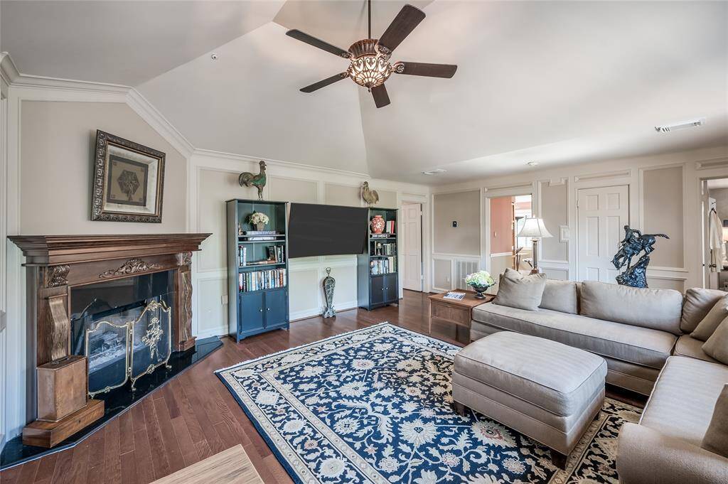 Soaring vaulted ceilings and 11-foot ceilings enhance the sense of openness in this oversized room.