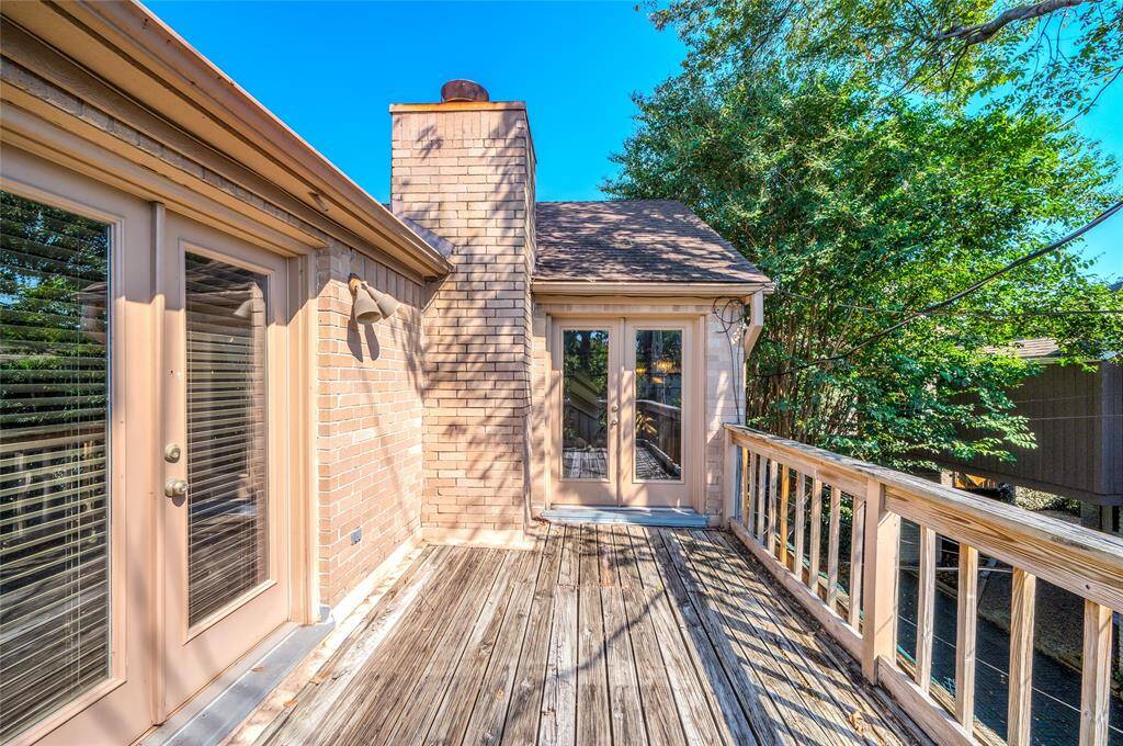 The expansive patio offers a tranquil retreat to unwind, with entrances from two of the home’s bedrooms.