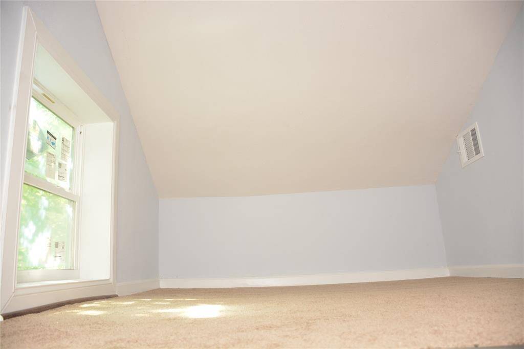 attic area with carpet and AC vent