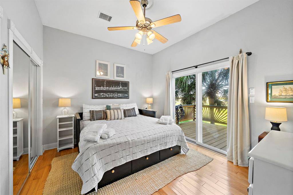 Offering privacy and comfort, this spacious guest retreat, just off the living area, boasts a king-size bed, mirrored closet, and sliding glass doors that open to the outdoor deck.