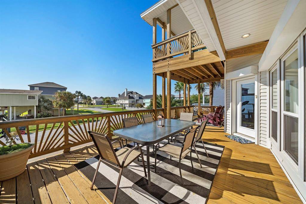 Enjoy views of the quiet, coastal neighborhood from this elevated deck, ideal for sipping a drink or relaxing with a good book. The beautifully crafted railing design adds both style and privacy.