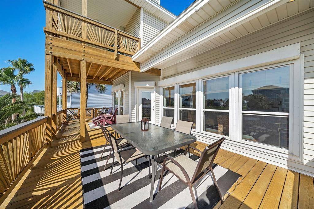 This spacious main-level deck offers plenty of room for outdoor dining and lounging. Whether you're hosting a sunset dinner or soaking in the sea breeze, this area blends indoor comfort with outdoor living.