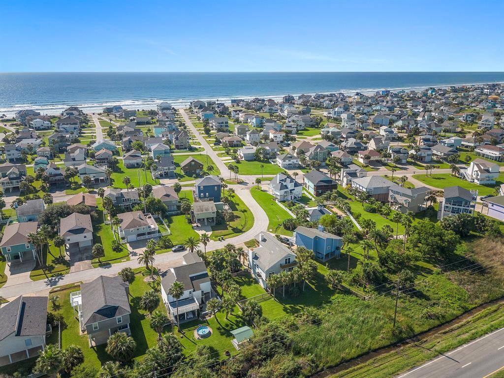 Bird’s-eye view of the subdivision looking toward the Gulf, giving a sense of how easily accessible the beach is from this location.