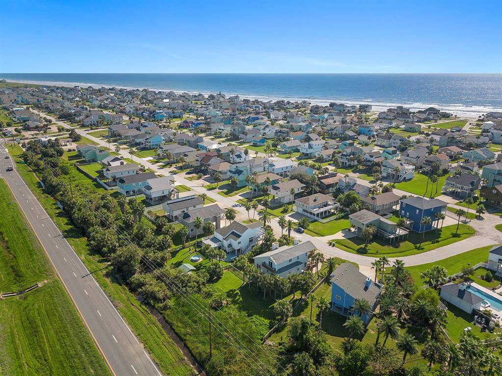 Zoomed-out neighborhood perspective with a clear view of the open green spaces and waterway nearby—emphasizing proximity to nature and peaceful vibes.
