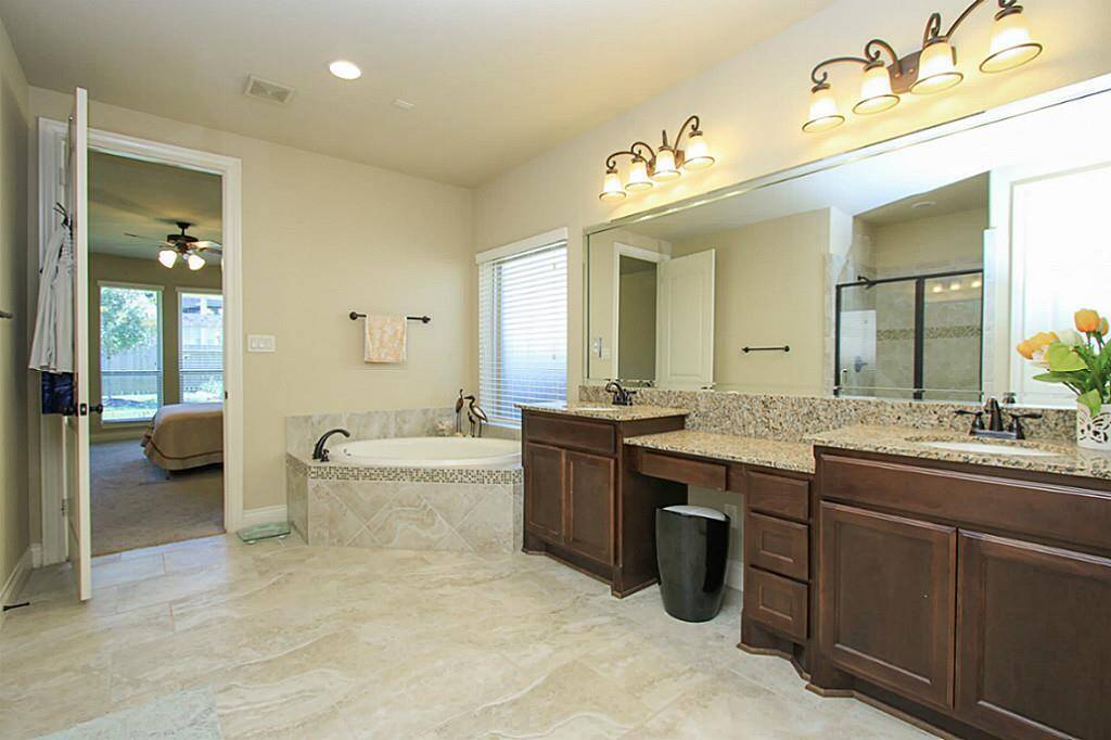 Enjoy an essential oil bath in this spa-like tub.