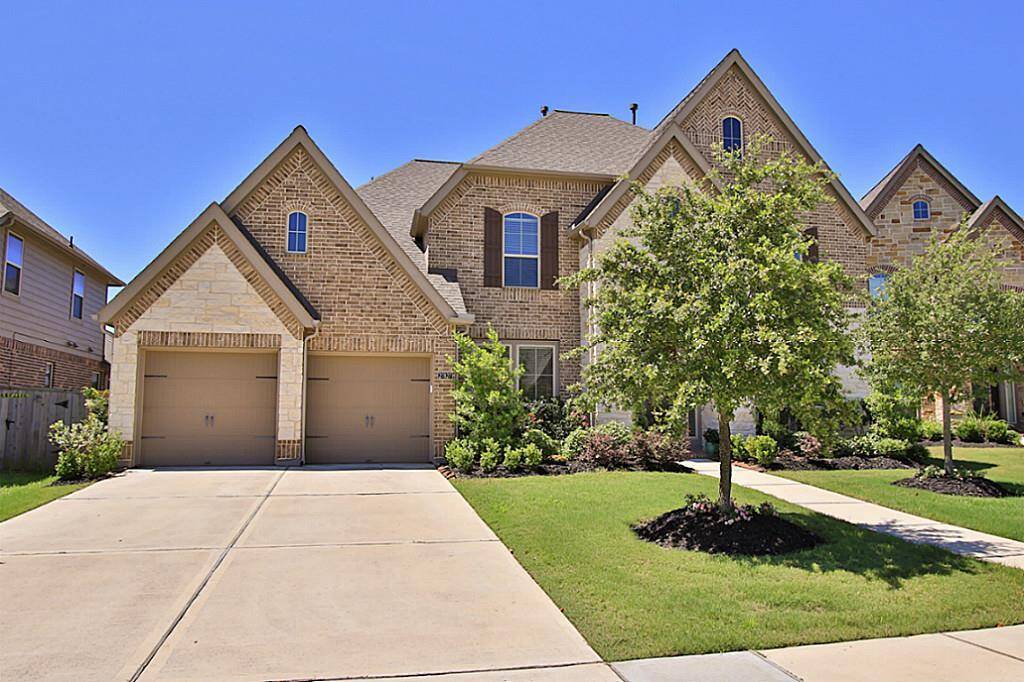 Stunning exterior front of this 3 car garage Perry home.