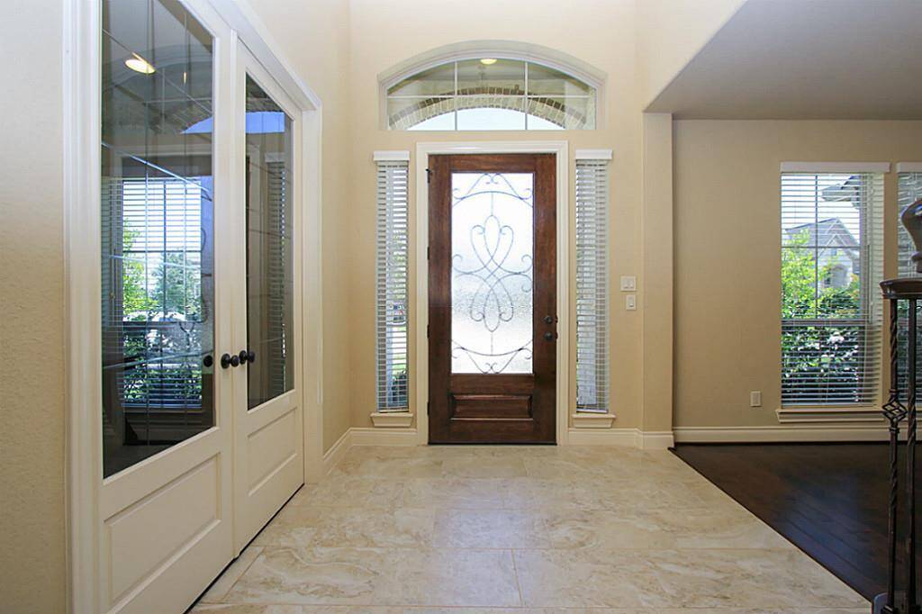View from the entry to the front door. Study with french-door on the left.
