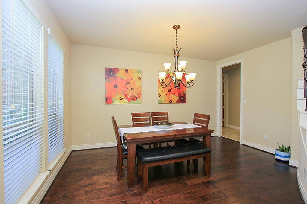 Formal dining with elegant hardwood flooring.
