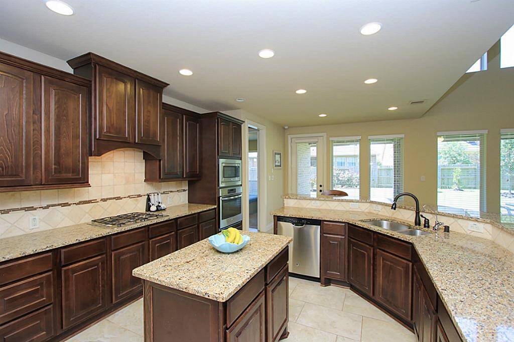 You will fall in love with this amazing kitchen with updated cabinets, granite counter top, island and stainless steel appliances.