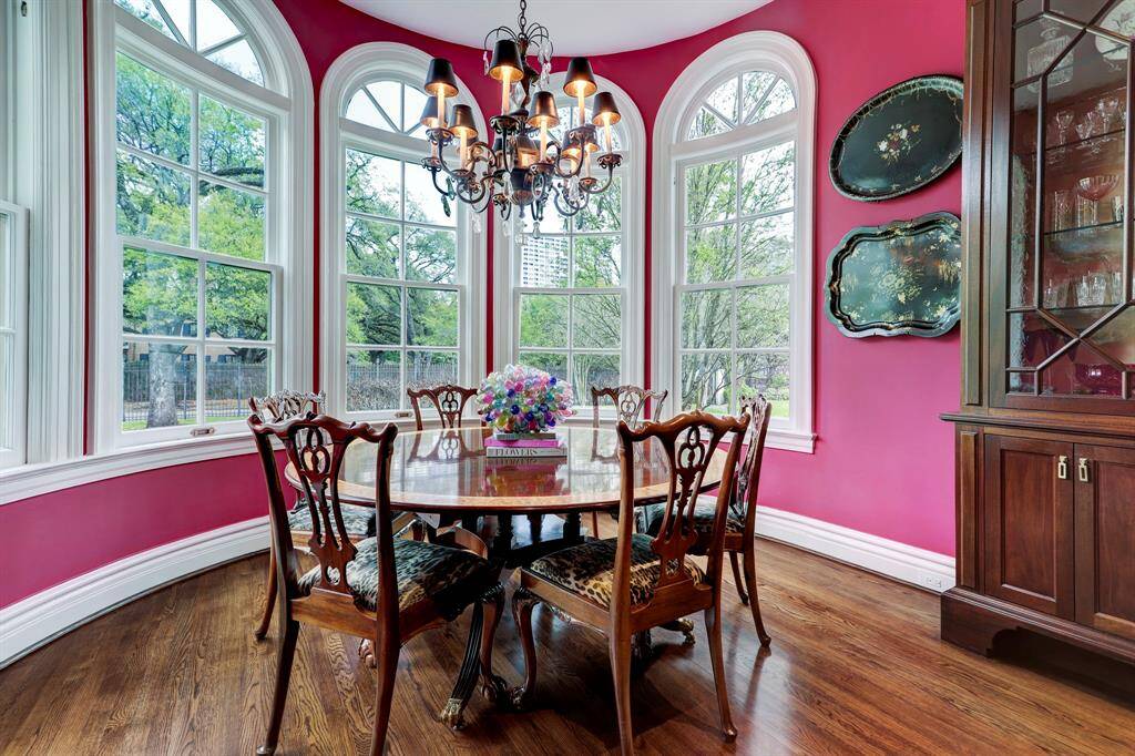 Rotunda Breakfast Room with walls of windows overlooking the expansive grounds.  The Breakfast room is open to the China Room.
