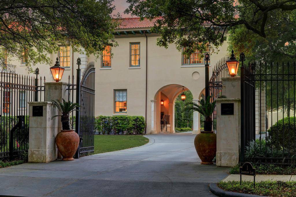 Private entry with electric gates, and newly paved drive leading to circular motor court with 2 car porte-cochere and additional parking adjacent to 3 car Carriage House