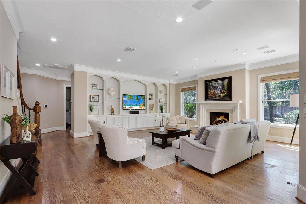 expansive living room with  great view of the back yards and pool area.