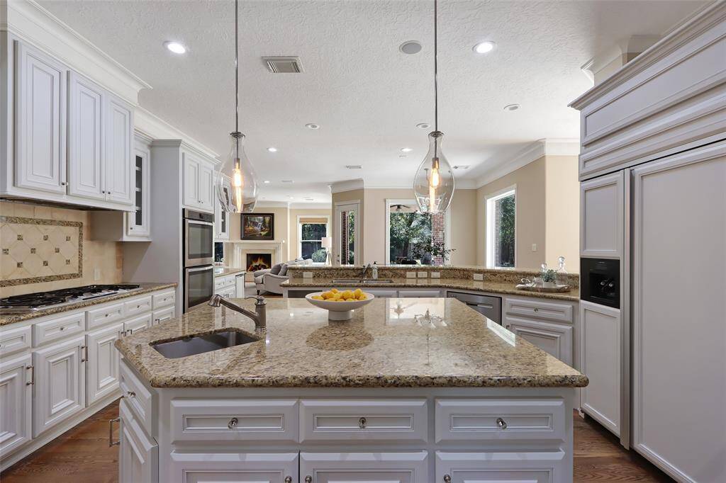 Spacious kitchen with island and breakfast bar.