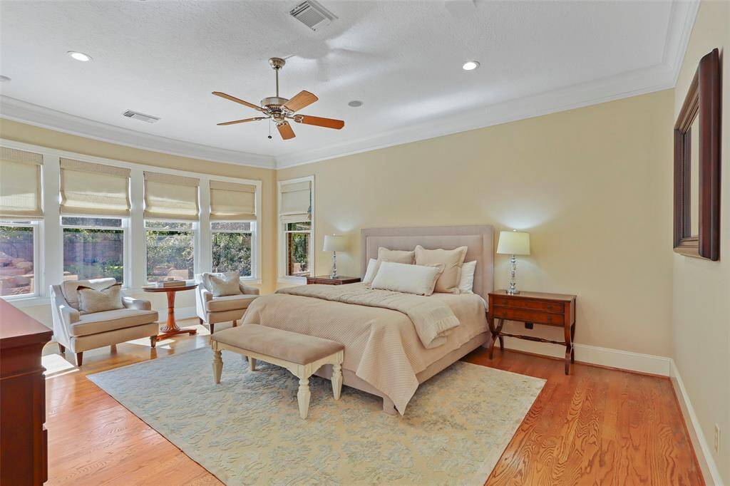 Primary bedroom with view and door to the pool and backyard.