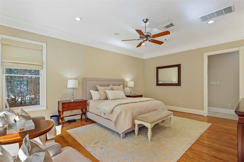 Primary bedroom with view and door to the pool and backyard.