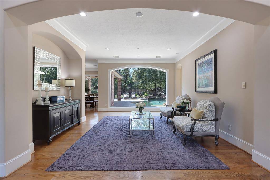 See through sitting area with view to the pool and back yard.