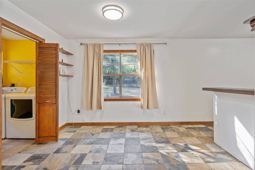 A look back into the dining room with the breakfast bar to the right.
