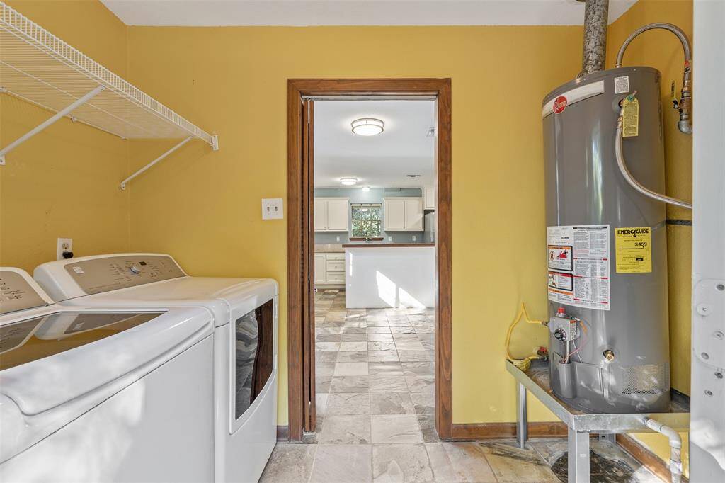 Utility room looking into the breakfast area and breakfast bar.