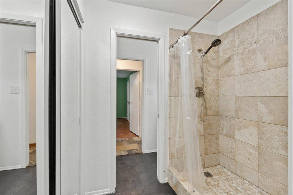 Nice size shower with tile, coming from the half bath.  See the floor plan for the layout.