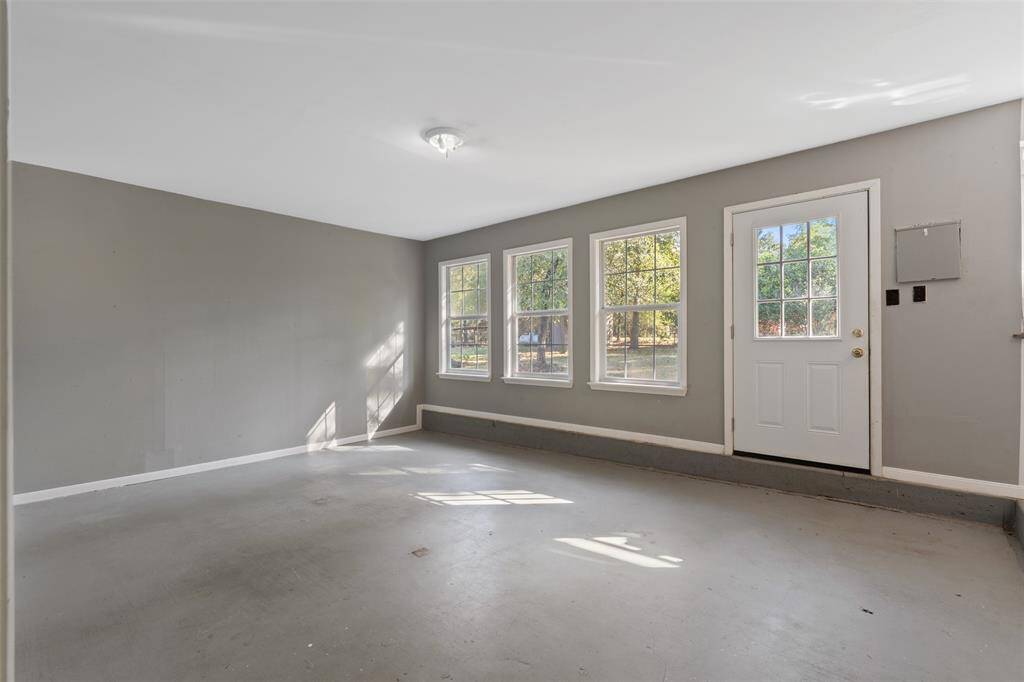 Here is the conversion for part of the garage. Notice the nice windows and door.