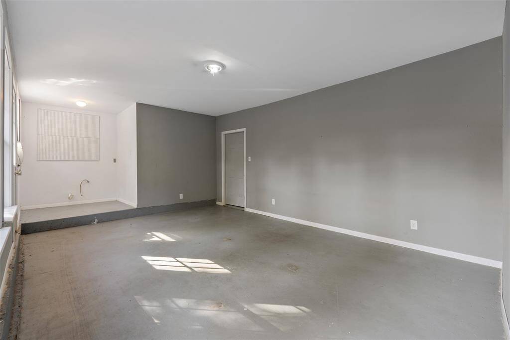 Here is another view, this  garage conversion has plumbing connections a window unit, and  could make for an office, or workshop.  Lots of options with this space as it is approximately 24 x 13 ft.