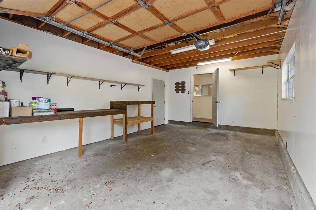 Here is the garage with workbench area and also notice the door at the back of the garage.